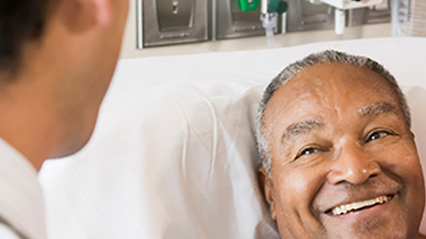 African-American-Man-in-Hospital-Bed-Smiling-at-Doctor