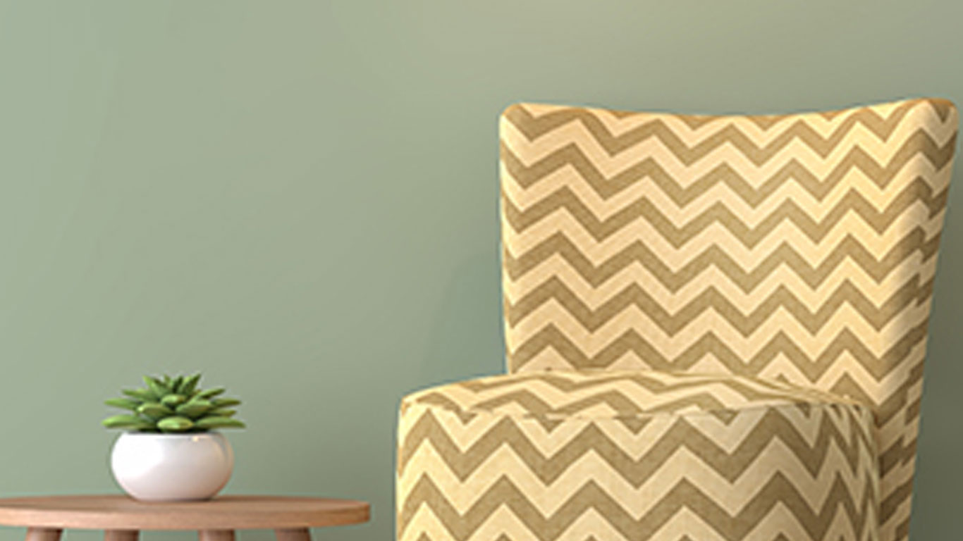Chevron-Fabriced-Chair-Next-to-Table-with-Succulent-on-it
